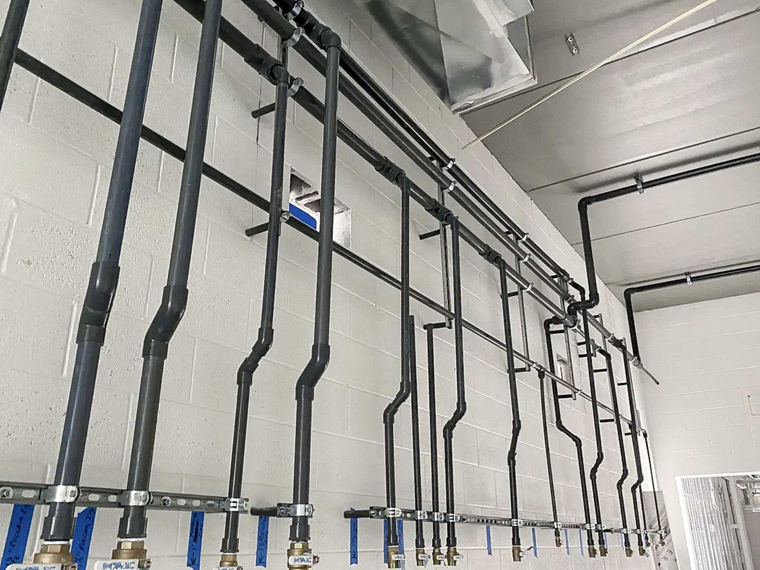 Completed specialty piping systems inside an Ameriteam commercial project